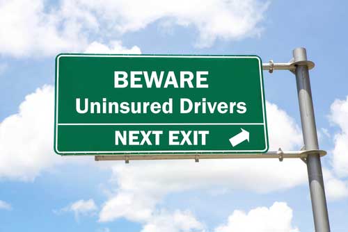 Uninsured motorist sign.